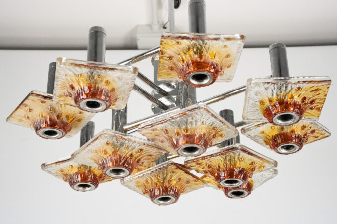 12-light Mazzega chandelier in amber and clear murano glass and chrome. Italy 1970s